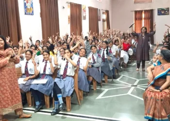 Dr. Sumita Prabhakar interacting with students during an adolescent health awareness session at St. Joseph's Academy, Dehradun.
