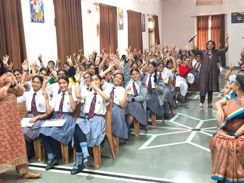 Dr. Sumita Prabhakar interacting with students during an adolescent health awareness session at St. Joseph's Academy, Dehradun.